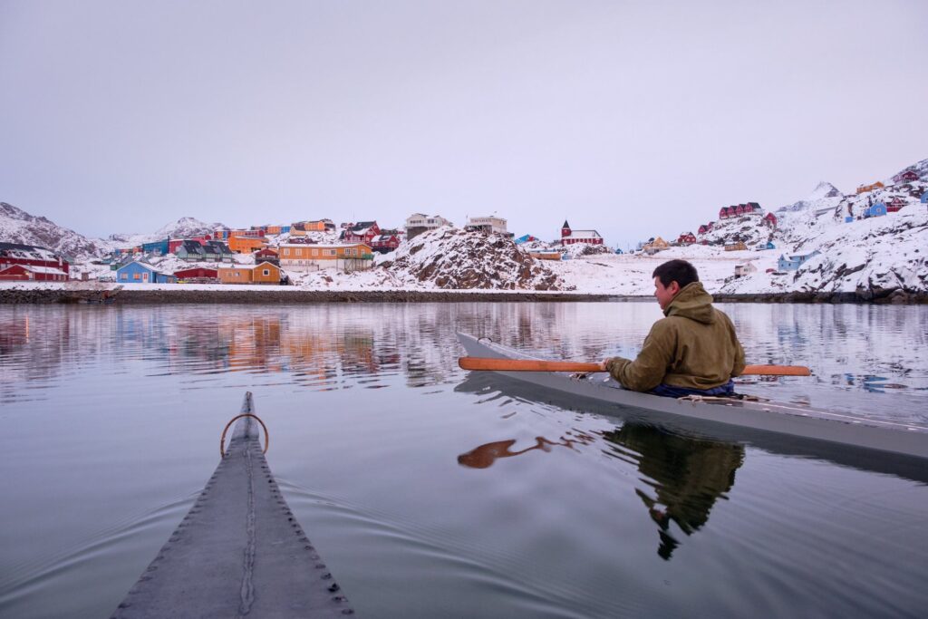 Kayaking in a traditional kayak in winter in Sisimiut - Guide to Greenland