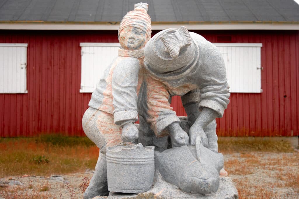 Aasianni Arnat Peqatigiit - one of several sculptures around Aasiaat displaying incredible craftsmanship