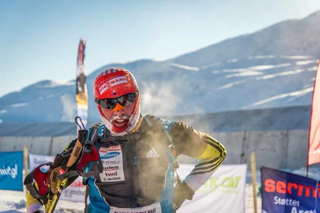 A participant in the Arctic Circle Race with a snow mustache