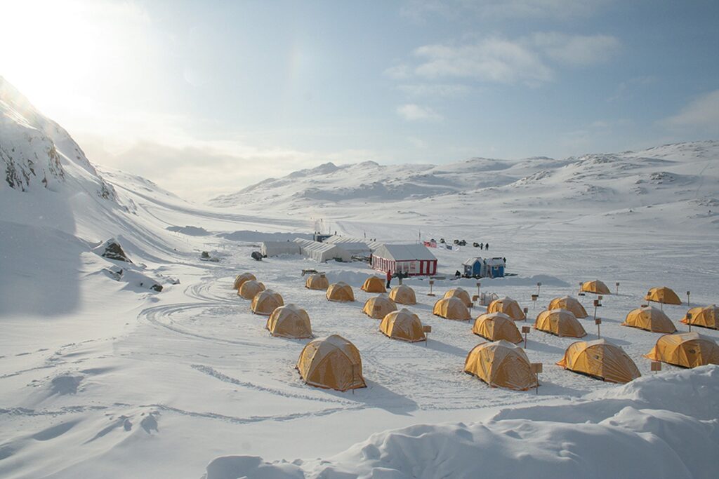 Yellow tent camp on the trail of Arctic Circle Race