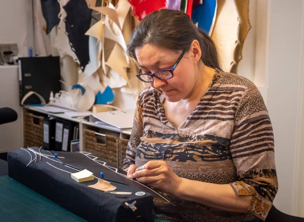 Artisan making one of the components of the Greenland National Costume at Kittat