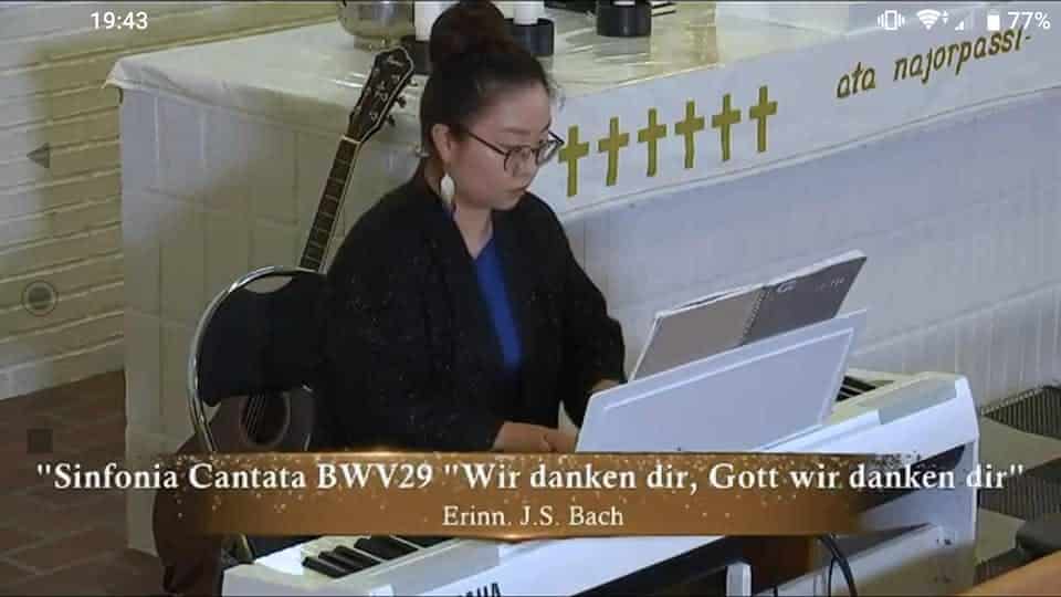 Woman playing the piano in church