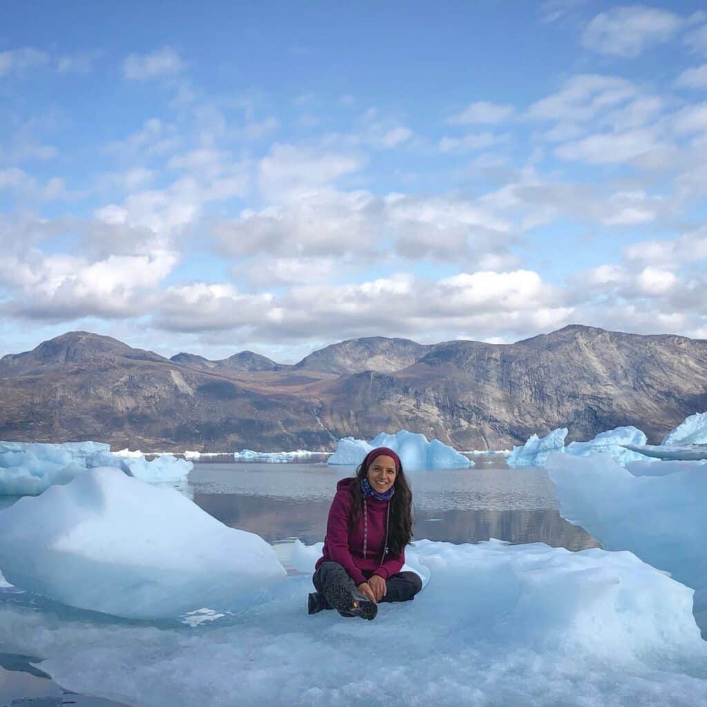 Girl sitting on iceberg