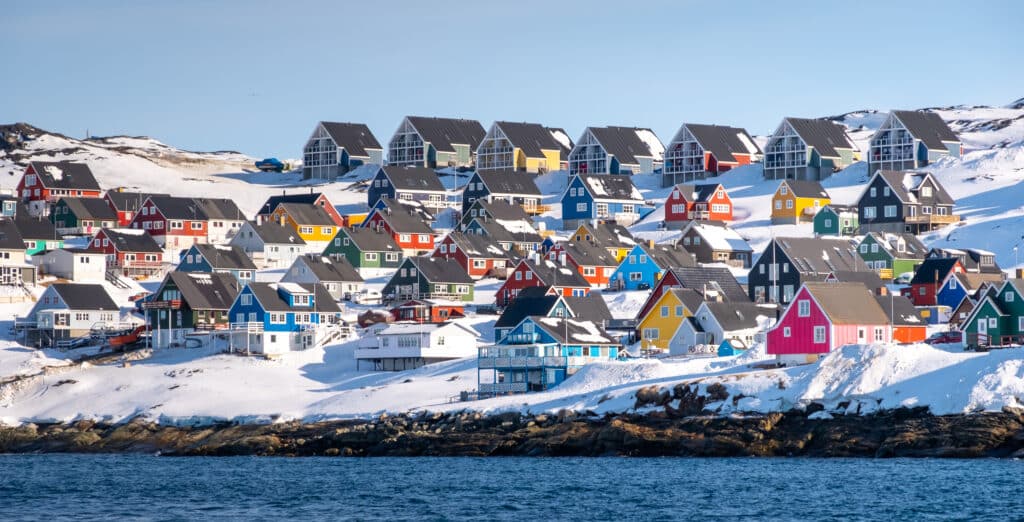 Colorful houses of Nuuk line the fjord