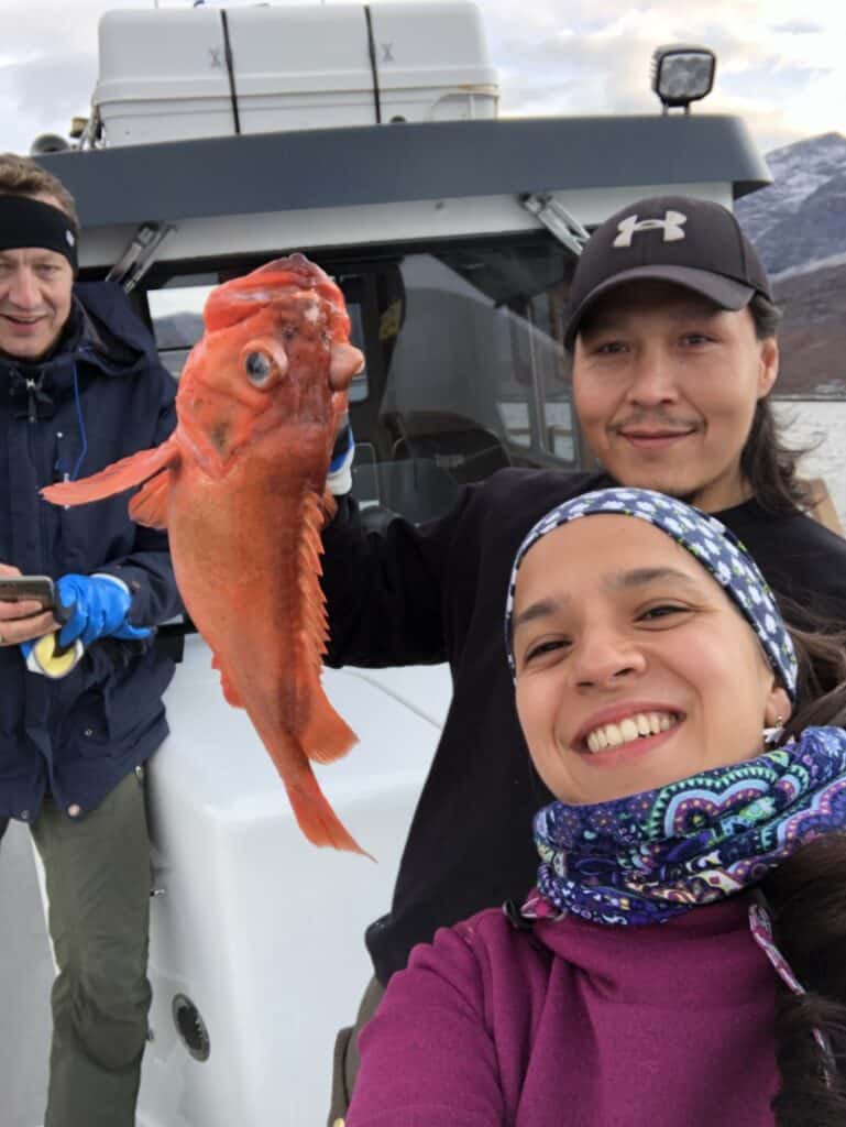 Three people one fish