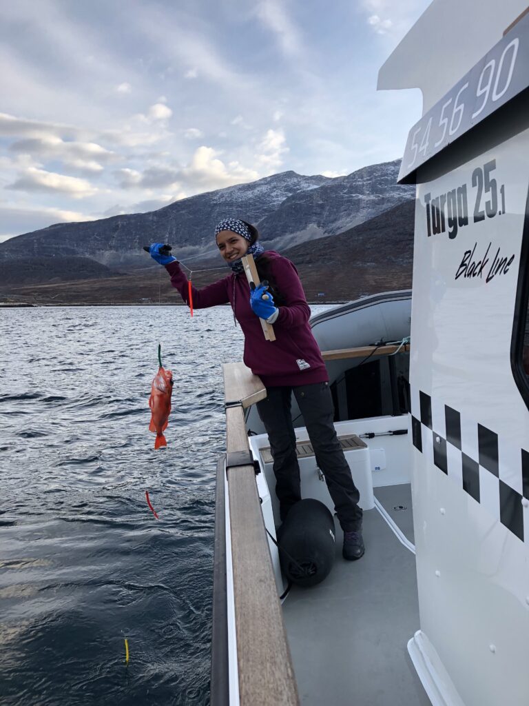 Woman holding a fish she caught