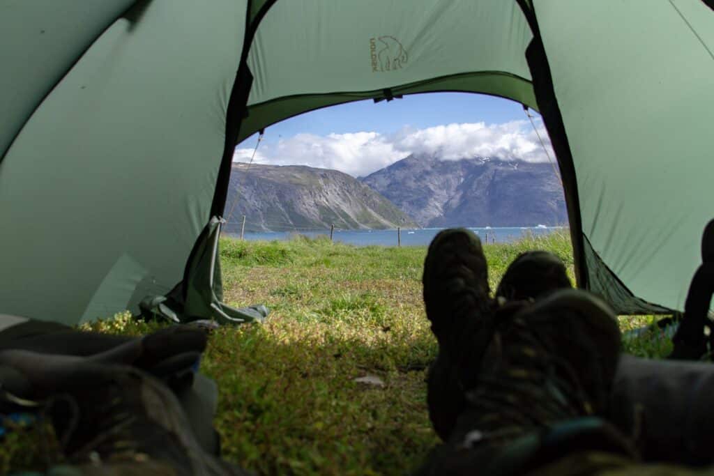 Woman wearing shoes staying inside a tent
