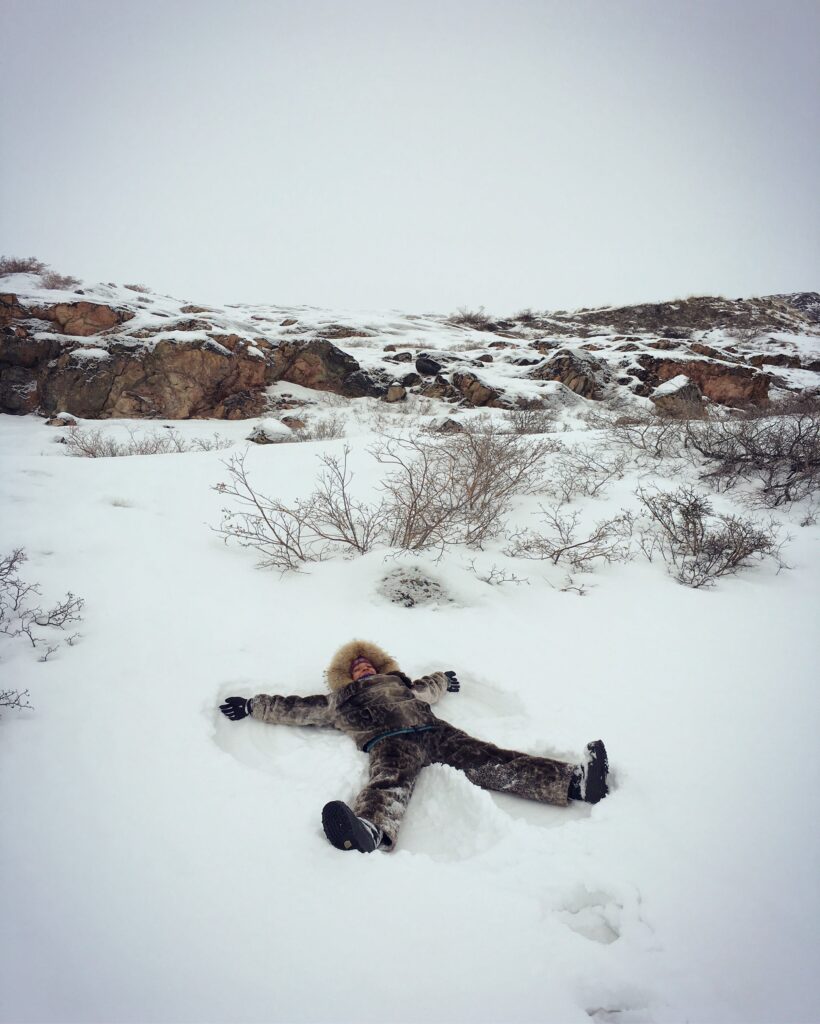 Girl making a snow angle