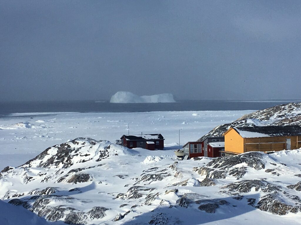 Houses with iceberg in the back