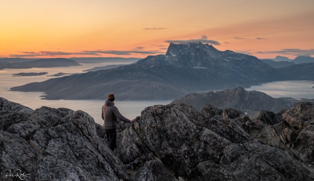 Man looking towards Sermitsiaq mountain in Nuuk