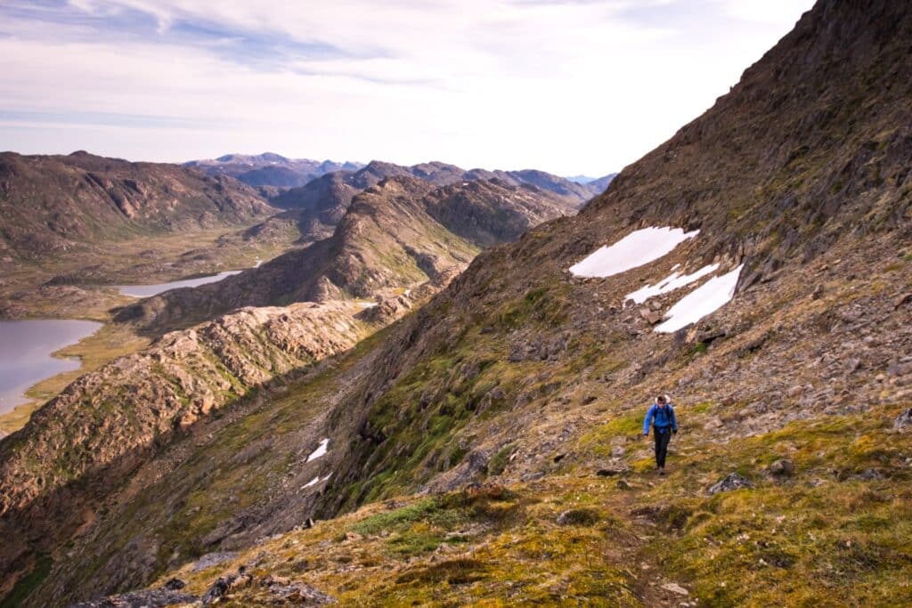 Guy walking in the mountians