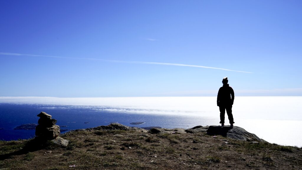 Woman on top of a mountain