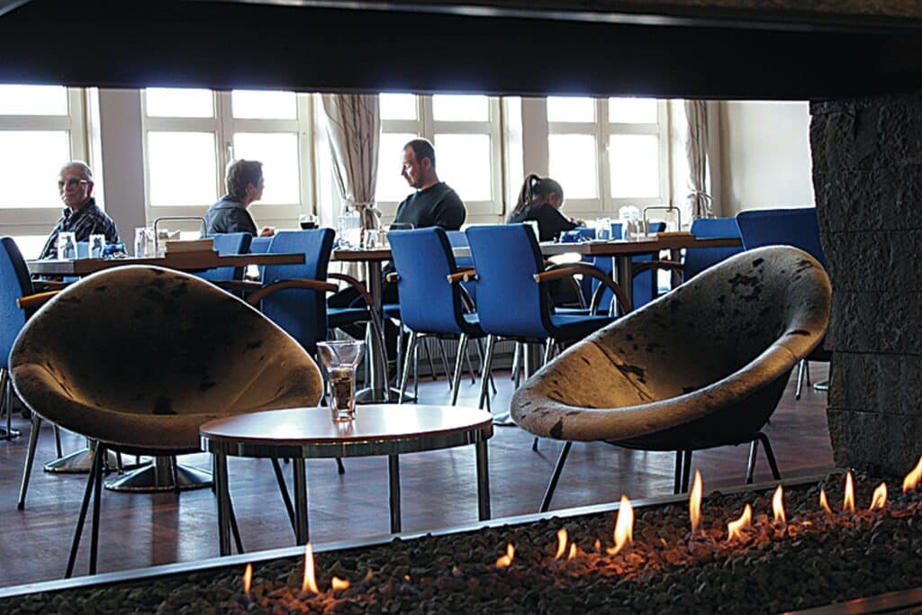 People enjoying food in a hotel restaurant in East Greenland