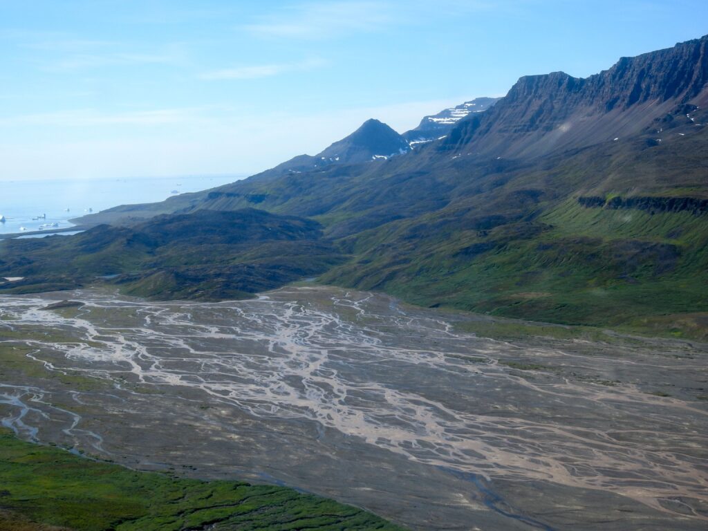Overlooking a wet area with mountains in the background