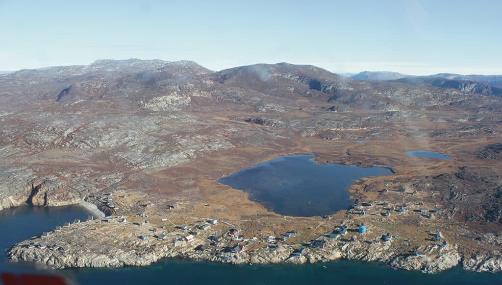 Flying over a small settlement in Greenland