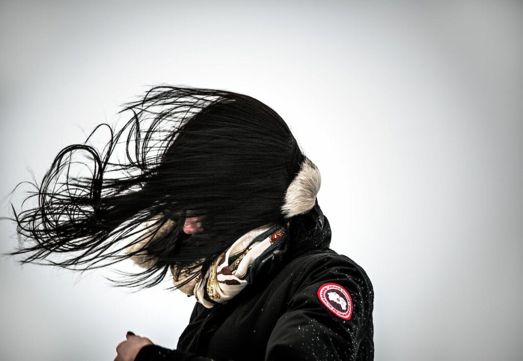 Woman standing in the wind