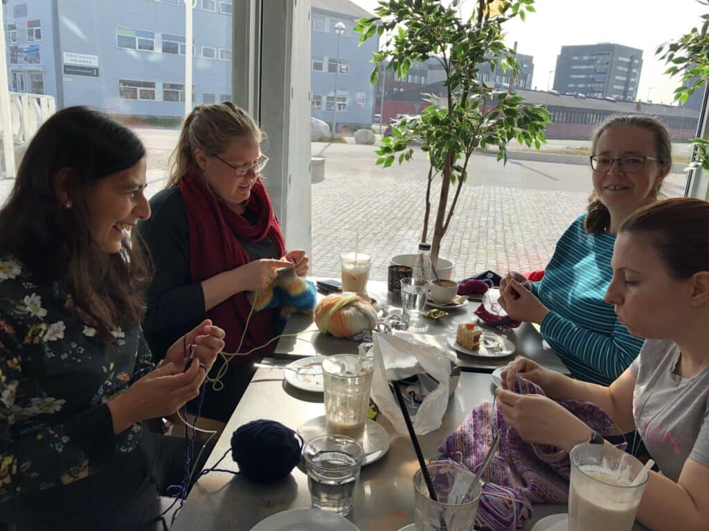 Four women knitting together at a cafe in Nuuk