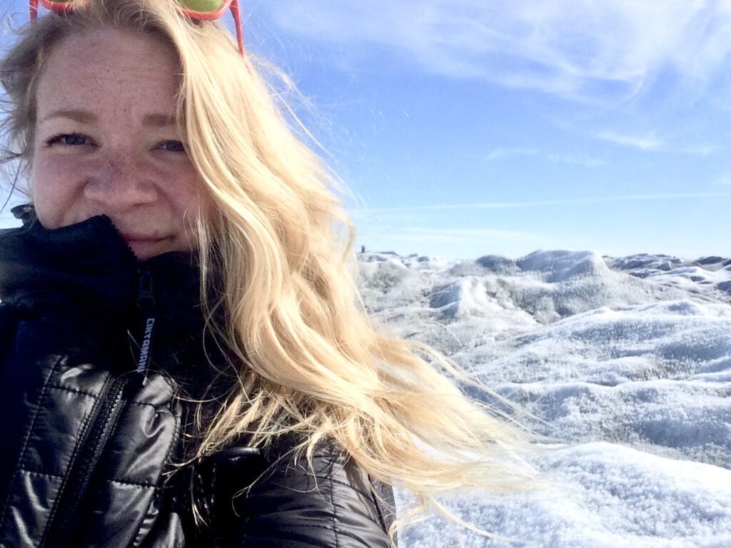 Woman taking a selfie with snow in the background