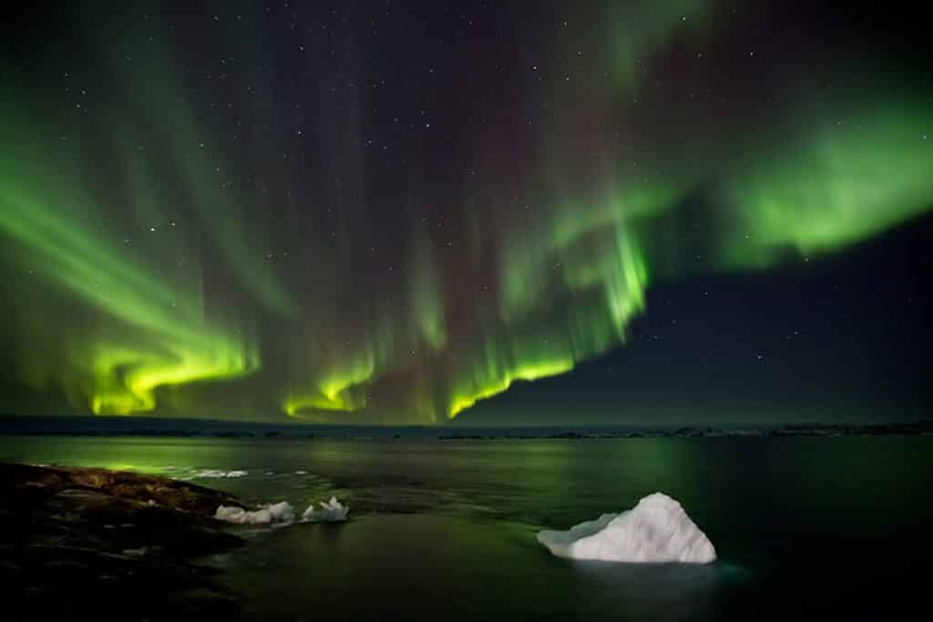 Northern lights over chunks of ice in Greenland