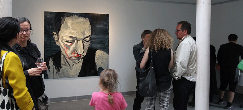 Art work presented in Nuuk Art Museum, a beaten woman bleeding from her eyes and nose