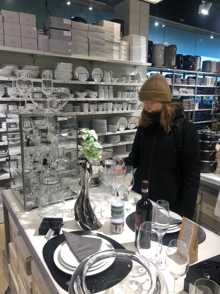 Woman looking at glasses in a store in Nuuk Center