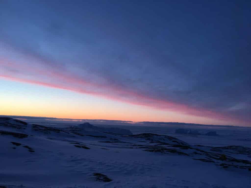 Snowshoeing with a red sky