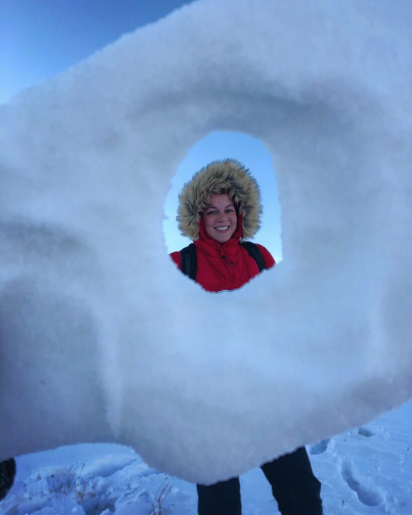 Woman seen through a hole in the ice
