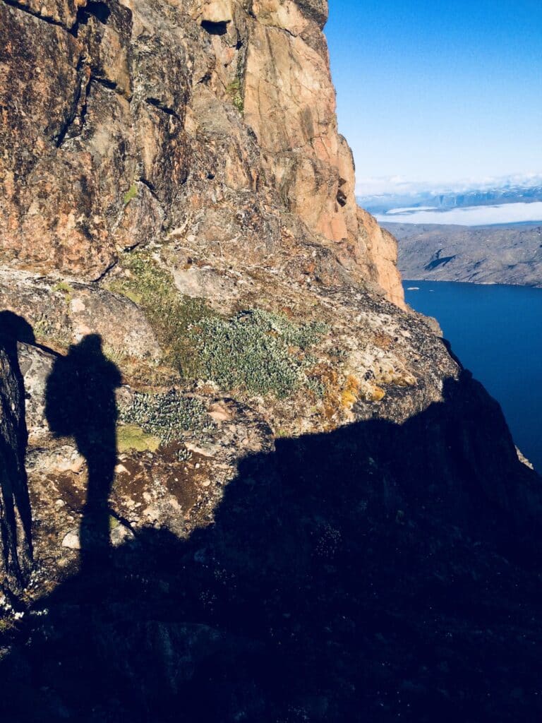 Shadow of a woman on a hike