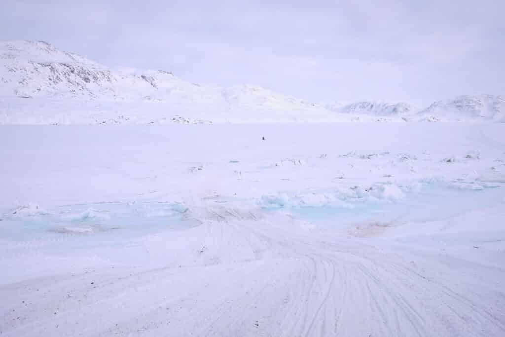 Snow bridge at the edge of the frozen Kangerlusarsuk Tulleq fjord near Sisimiut