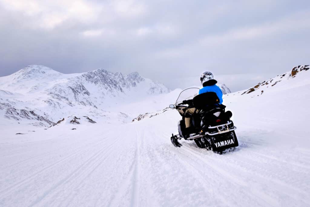 Snowmobiler looking down the route back to Sisimiut past nasaasaaq mountain